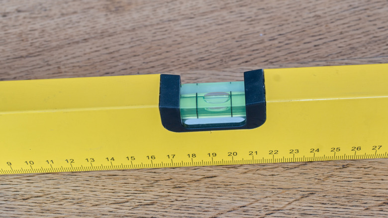 A bubble level on a piece of wood