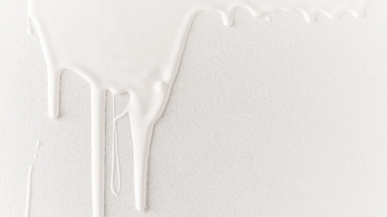 dripping white paint