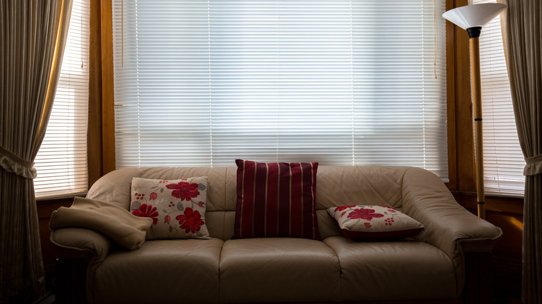 two floral pillows on sofa