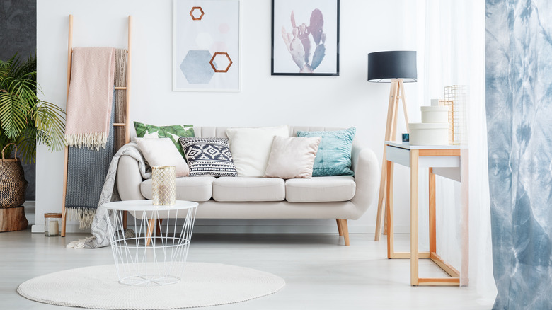 light wood ladder next to sofa