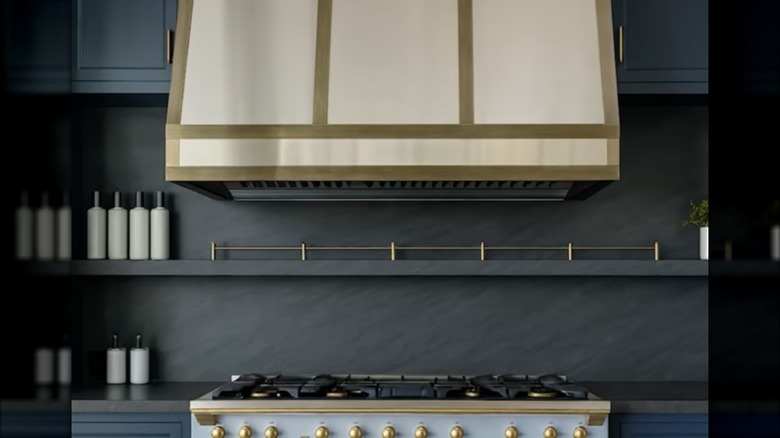 A trendy kitchen with darker cabinets and countertops