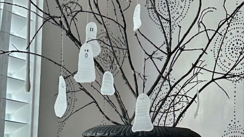 Glue ghosts with open mouths hanging off a tree