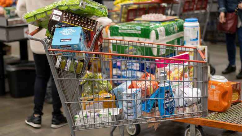 shopping cart full of bulk Costco products