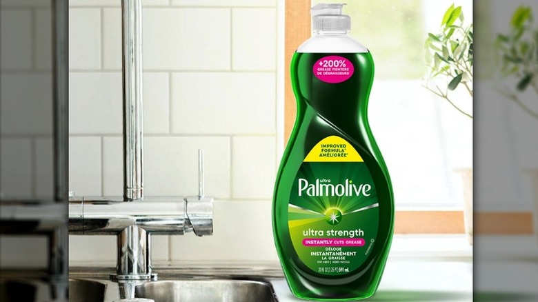 bottle of palmolive dishwashing soap next to sink