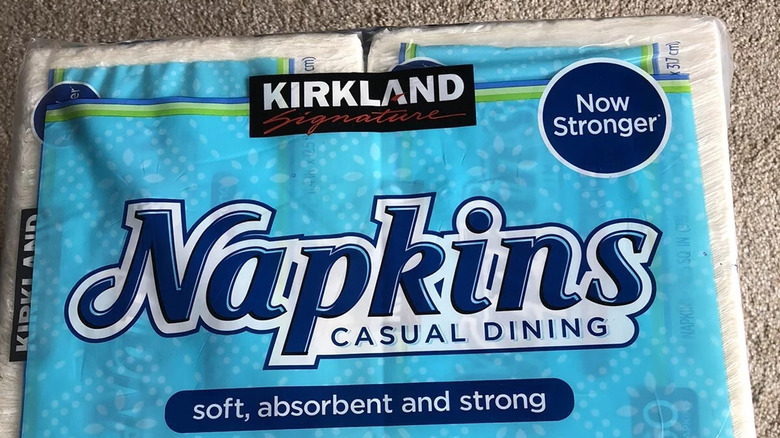 Kirkland Signature dining napkins in bulk pack on carpet