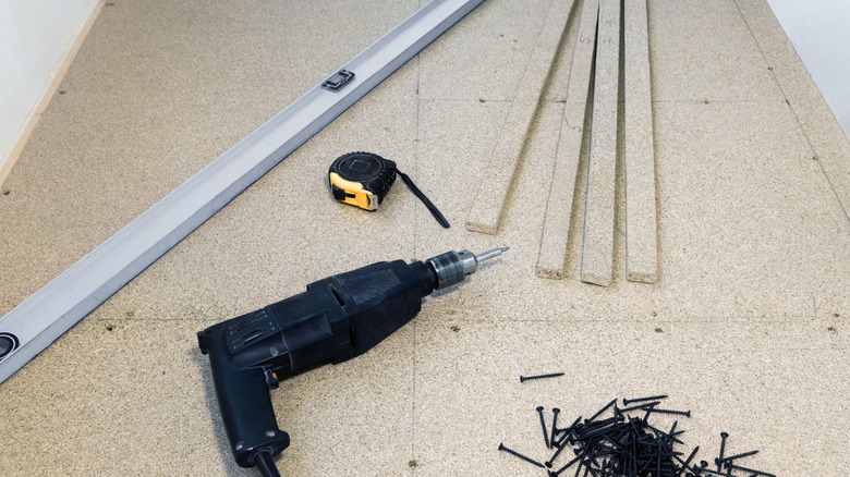 Long level, tools, and screws
