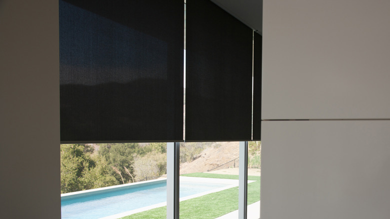 modern interior with rollout black shades