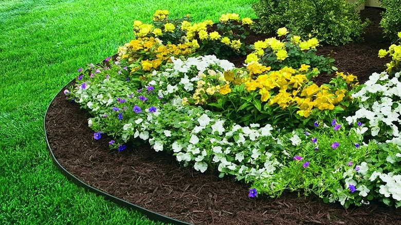 EasyFlex Heavy Duty No-Dig Edging Kit around a flower bed