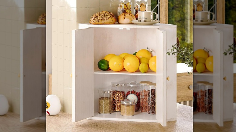 The Trironsun Bread Box on a counter with lemons and dry goods stored inside