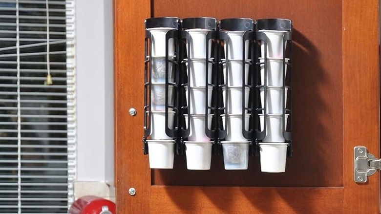 Two Storagenie K Cup Holders hanging on the inside of a cabinet door