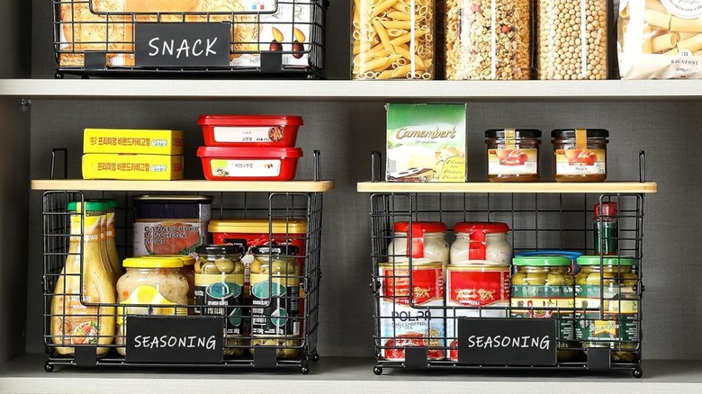 Wire baskets in shelves holding pantry items