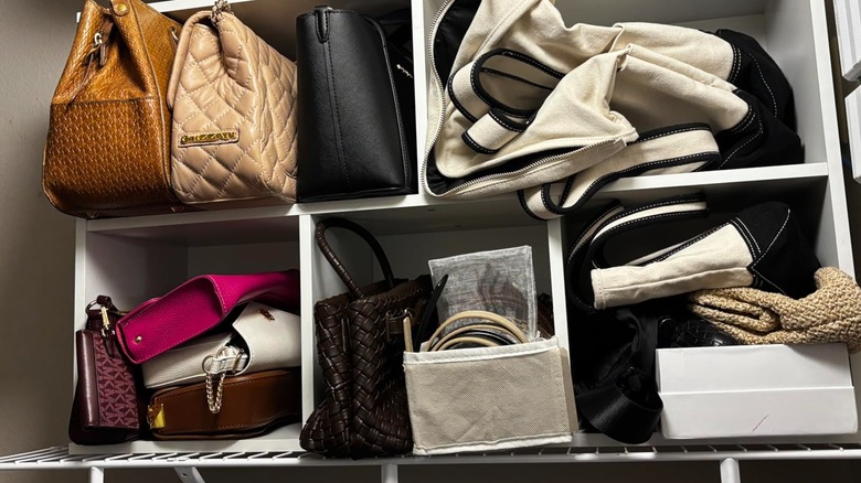 A white Amazon Furinno Reed cube shelf closet organizer used for purses and bags
