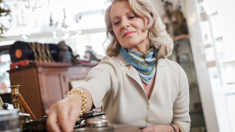 Woman shopping at antique store.