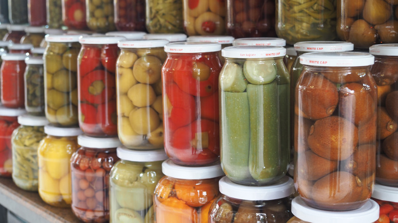 Lidded jars with fruits and veggies