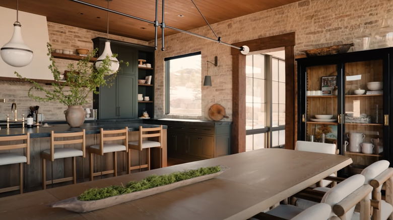 Farmhouse kitchen with modern lighting fixture