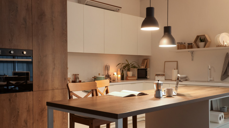 An island in a wood and beige kitchen