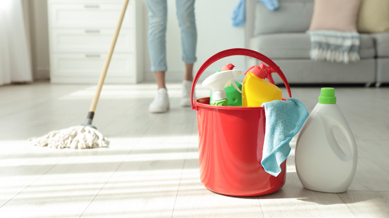 Cleaning supplies on floor