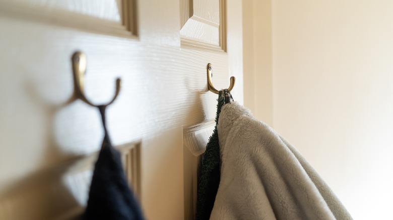 Clothing hanging on bathroom door