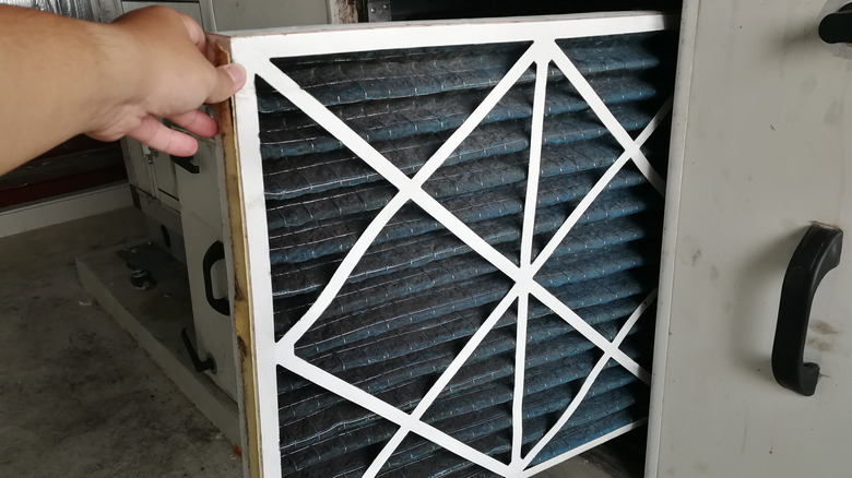 Person removing air filter