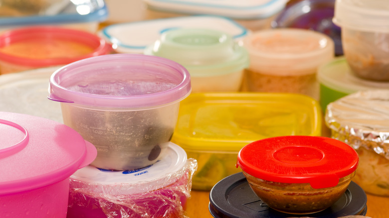 Dirty plastic tubs and containers
