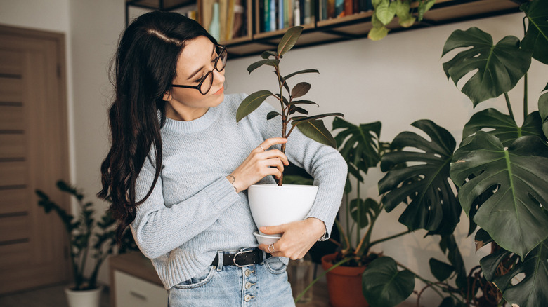 Female admiring plants