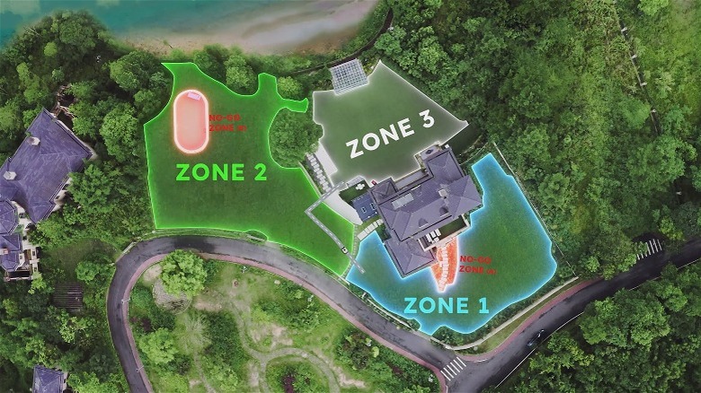 A satellite view map showing mowing zones around a house