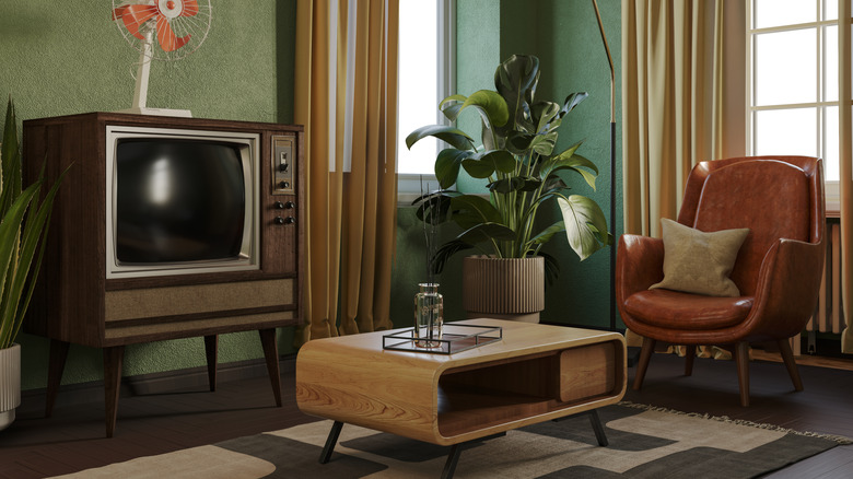 Mid-Century Modern living room with tv, chair, table