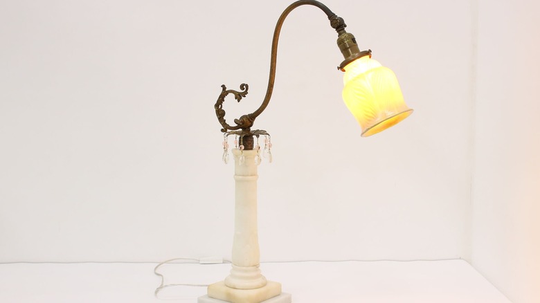 A Victorian carved alabaster tabletop bridge lamp