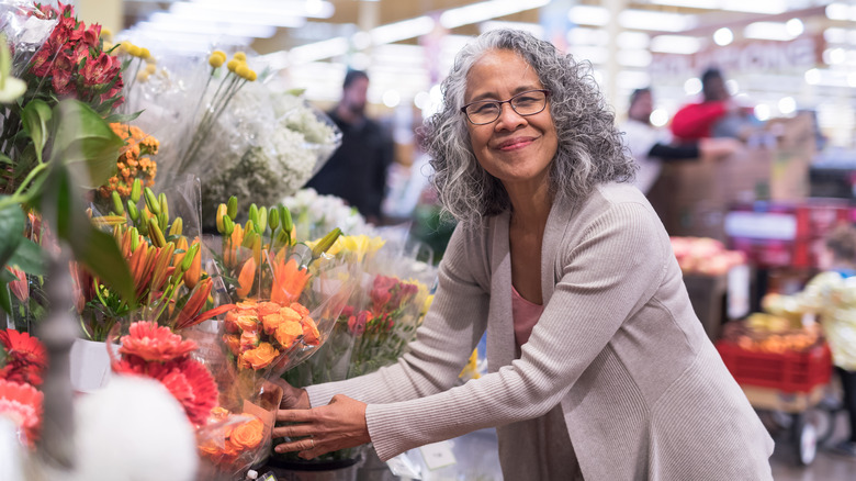 Person shopping for fresh flowers