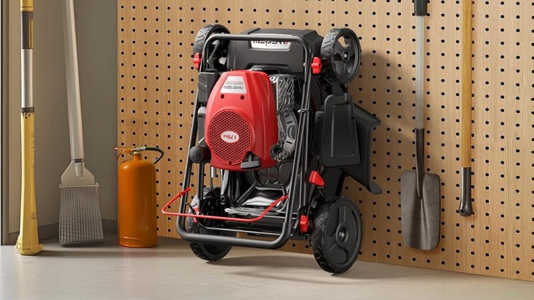 An Amerisun lawn mower with the handle folded for compact storage