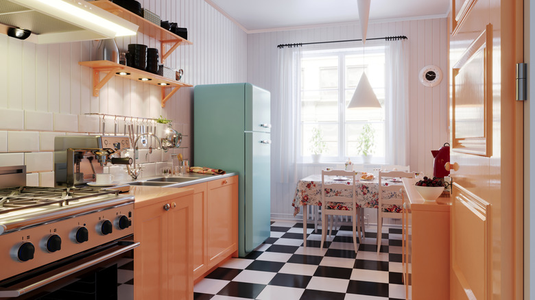 Retro style kitchen with freestanding appliances and cabinets