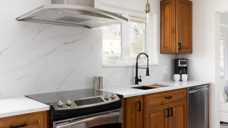 Calacatta gold quartz kitchen sink countertop and backsplash