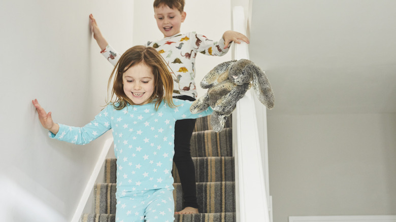 Kids running down carpeted stairs