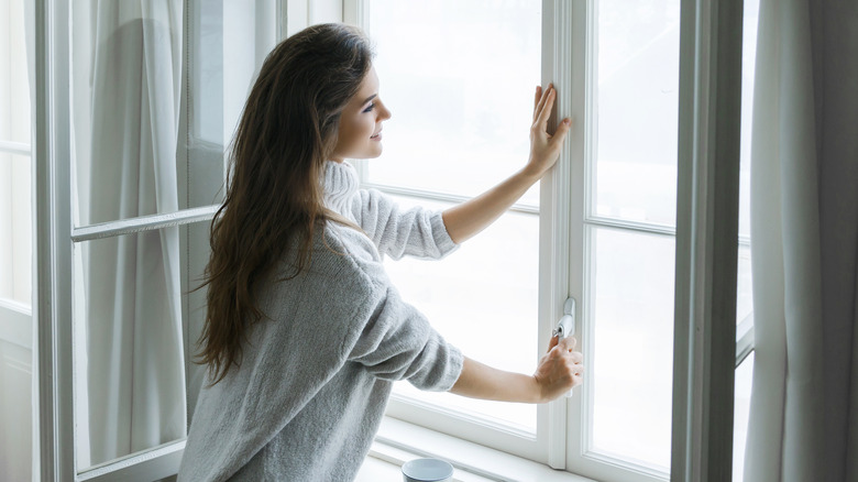 cozy woman feeling cold window