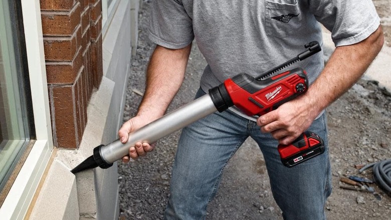 The Milwaukee M18 cordless 20 ounce aluminum barrel caulking gun