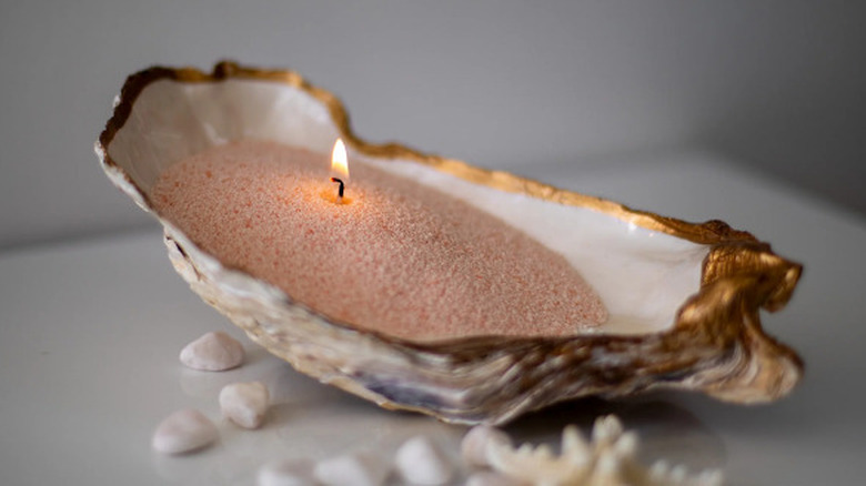 Candle burning in a shell