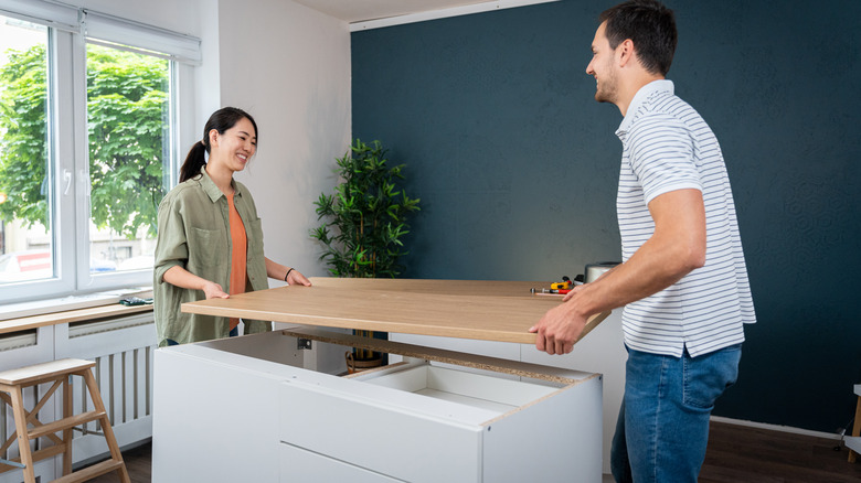 Couple installing countertops