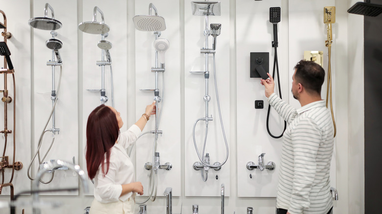 Couple shopping for shower heads in store