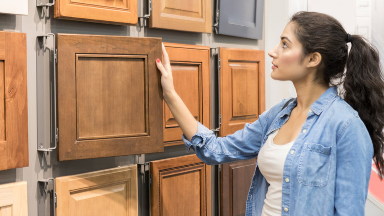 Woman shopping for cabinets