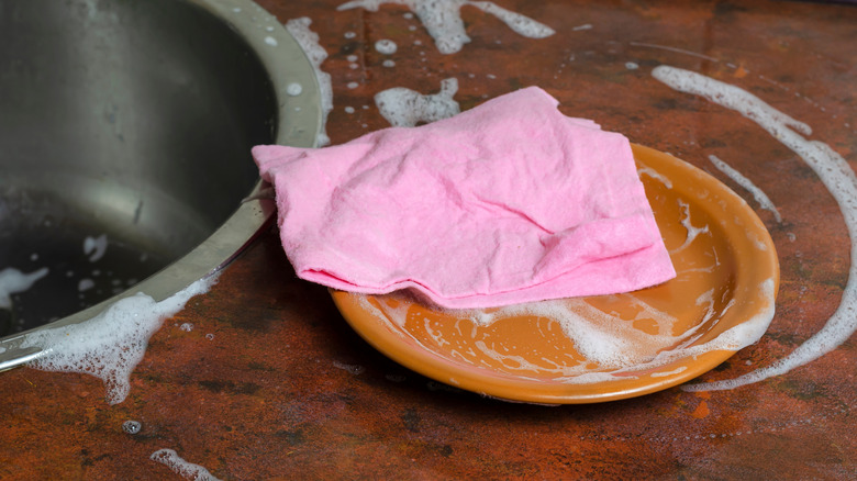 Reusable paper towel on soapy plate