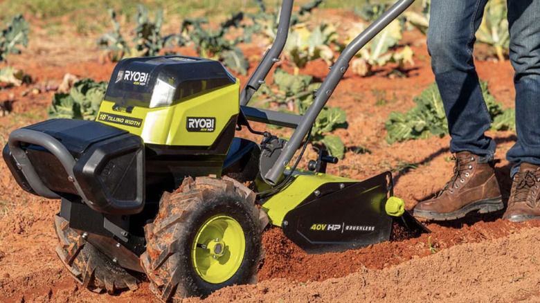 Ryobi's 18-inch rear tine tiler working in a garden
