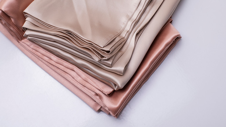 folded silk pink bedding
