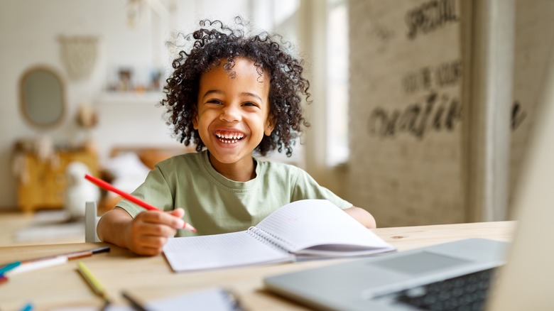 child learning at a desk