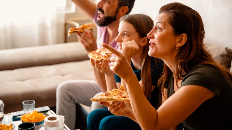 family enjoying movie night