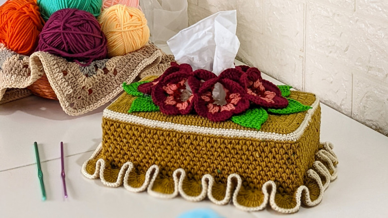 Crochet tissue box cover and bowl of yarn