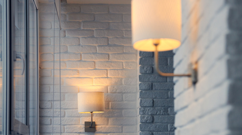 Brick wall and sconces 