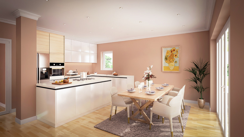 A modern kitchen utilizing warmer tones of muted pink and sand