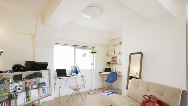 A home office with white walls and a white ceiling