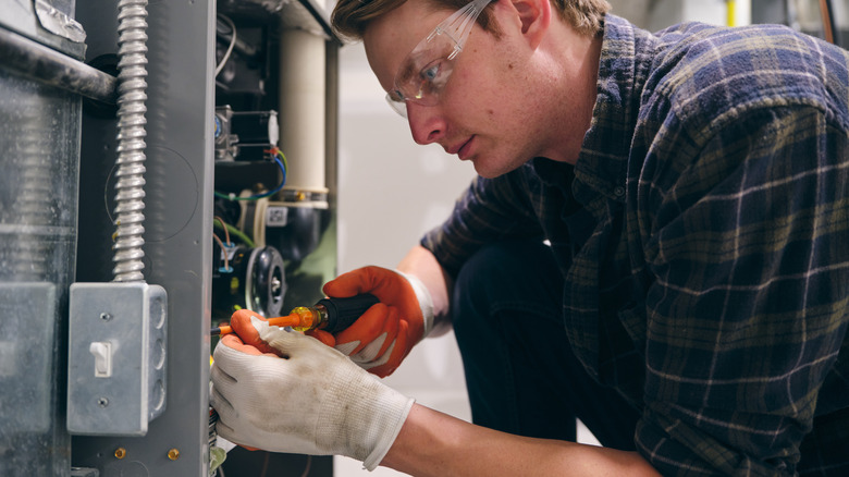 Technician working on a furnace