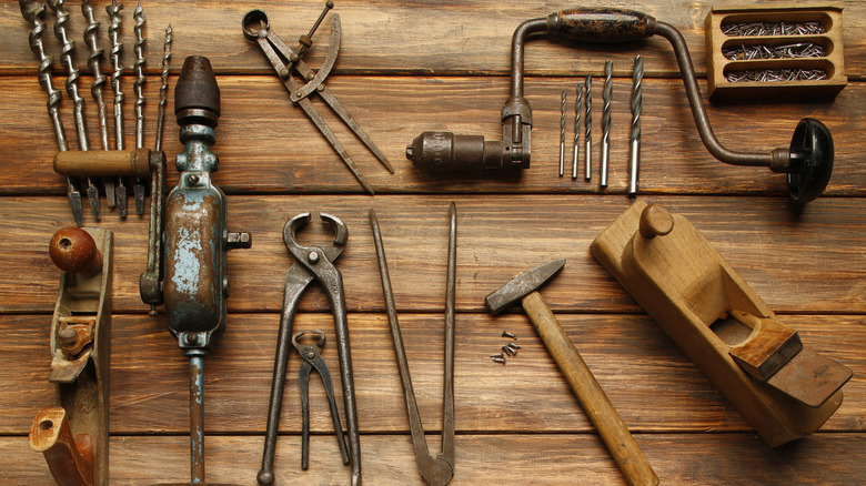 Vintage tools on wooden surface